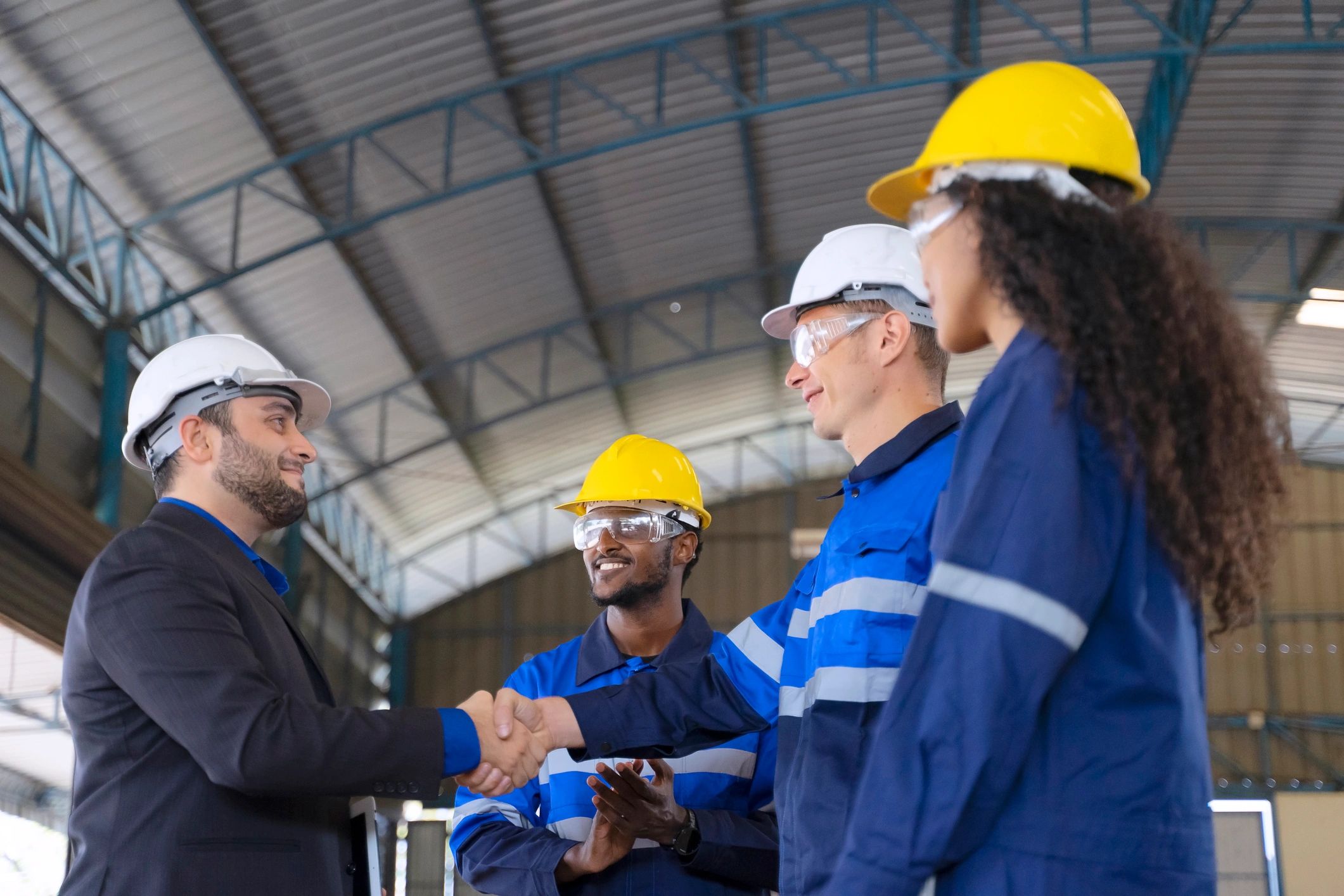 Industrial team working together in a modern factory environment